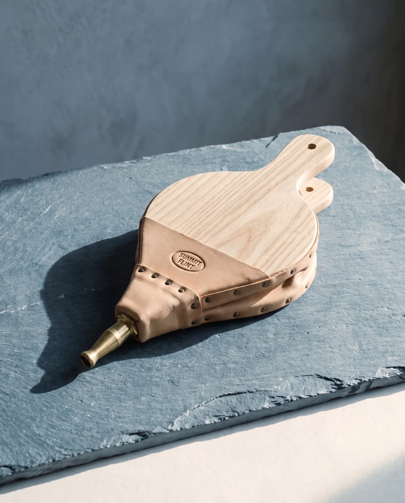 Ash & Leather Bellows — Bridle-hide gusset, brass nozzle, re-hideable.