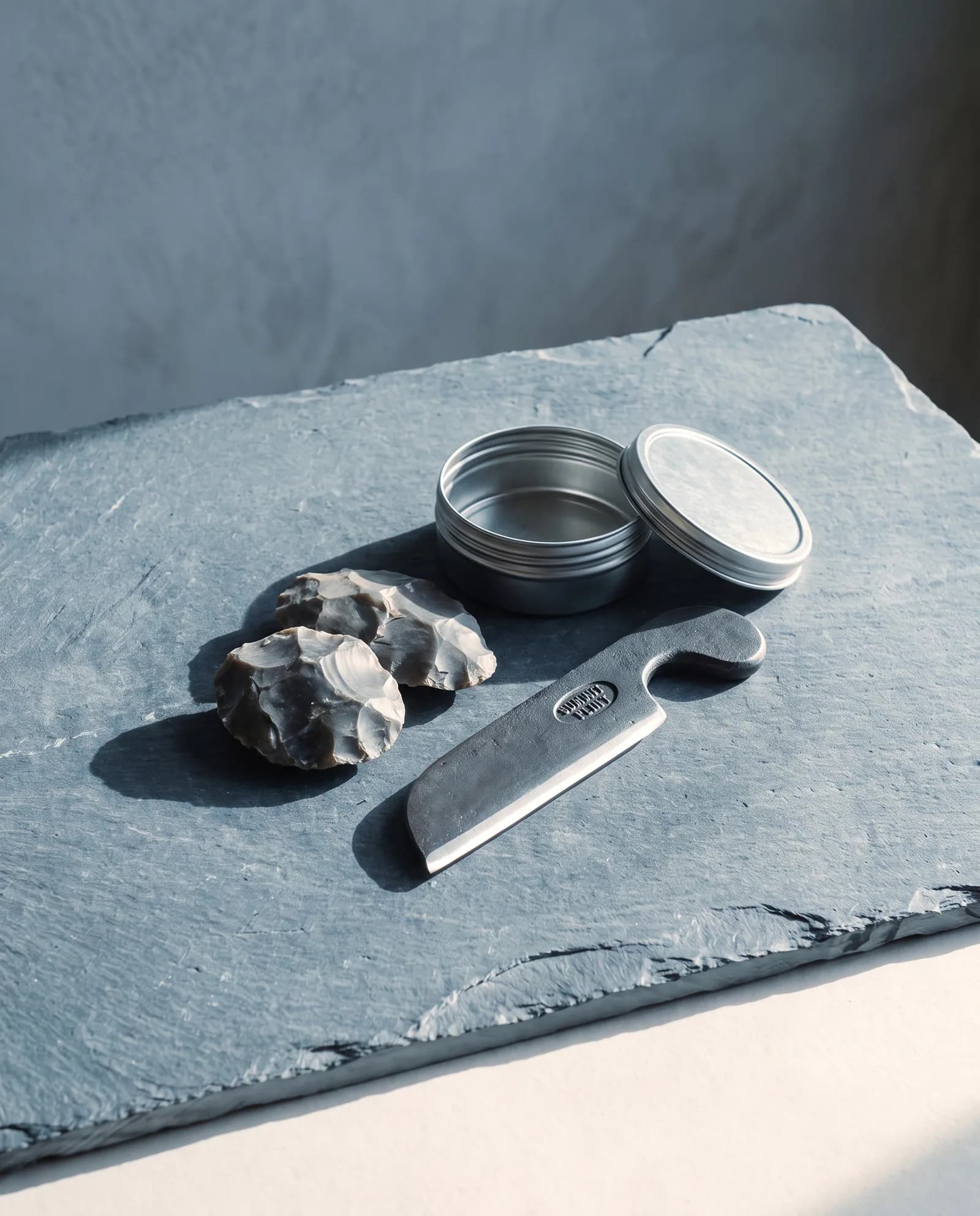 Flint & Steel Striker — Forged carbon steel striker, flint, and a tin.